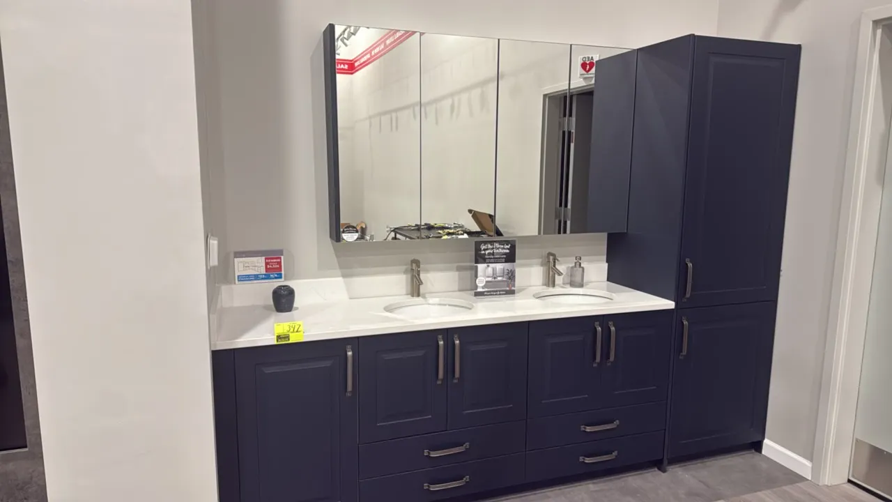 Infinity Architec double vanity cabinet suite. Features matte navy blue finish, composite countertop, two undermount oval sinks, two single-handle fau