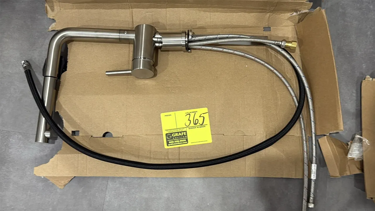 Single-handle pull-down kitchen faucet. Features single-lever control, pull-down spray head, and flexible braided supply lines.
