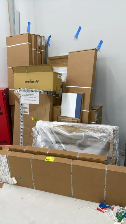Wren Kitchens assorted cabinetry components and showroom display items. Includes boxed sample doors in assorted finishes, pavement stand base, flat pa