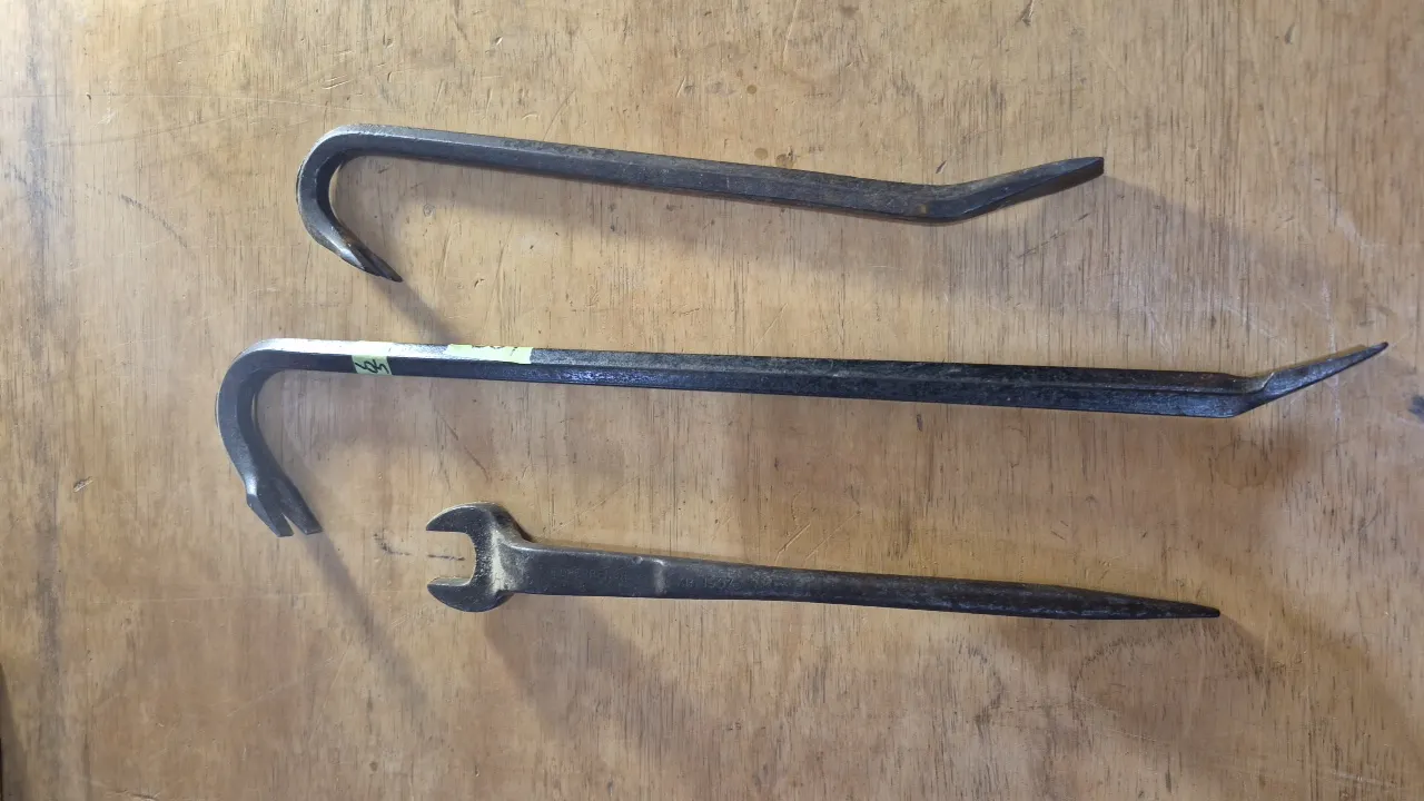 TWO TIRE IRONS AND WRENCH
