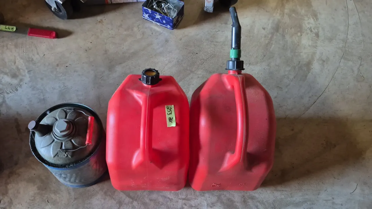 3 GAS CANS: TWO PLASTIC, ONE METAL