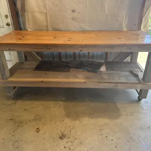 Wooden work table on casters. 7’ length.