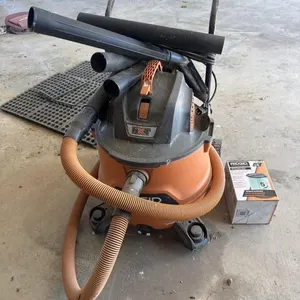 Rigid shop vac with attachments and extra filter.