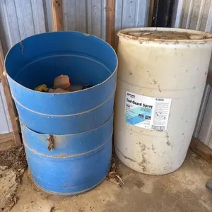 Two barrels cut in half. One full emty barrel.