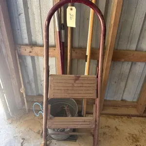 Step ladder, utility pail, broom with dustpan.
