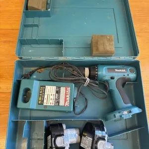 Makita power drill with two batteries and