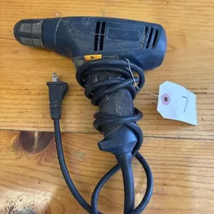 Electric power drill. Plugged in and it works.
