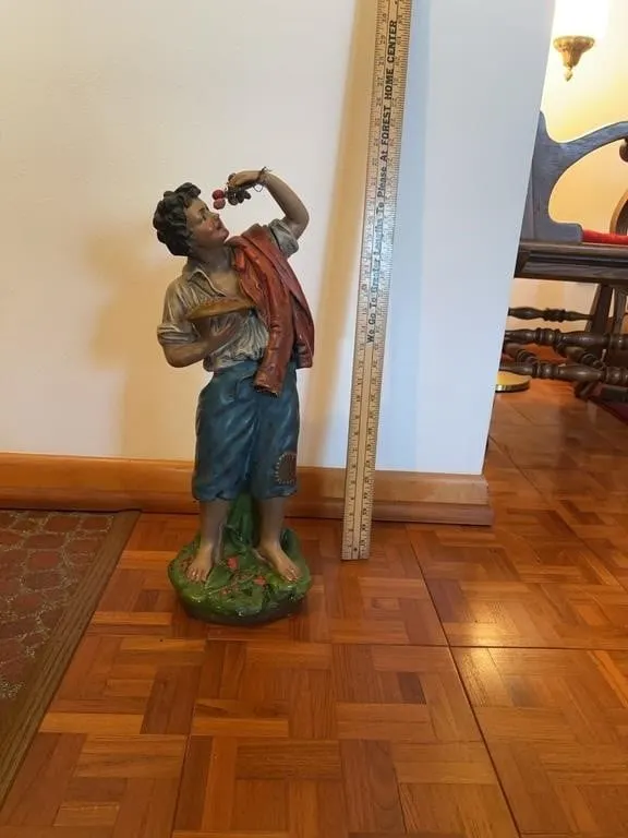 Painted Terracotta Figure of a Boy Eating Grapes