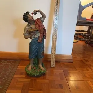 Painted Terracotta Figure of a Boy Eating Grapes