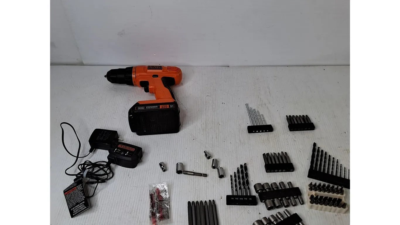 Black & Decker Drill With Battery & Charger (powers on), Various Drill Bits