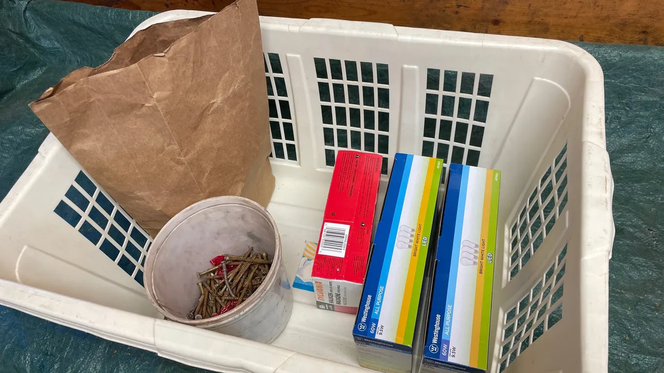 Plastic Basket with Light Bulbs, Screws, and Fasteners