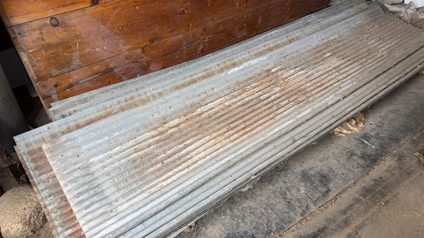 Stack of Corrugated Galvanized Metal Roofing Sheets