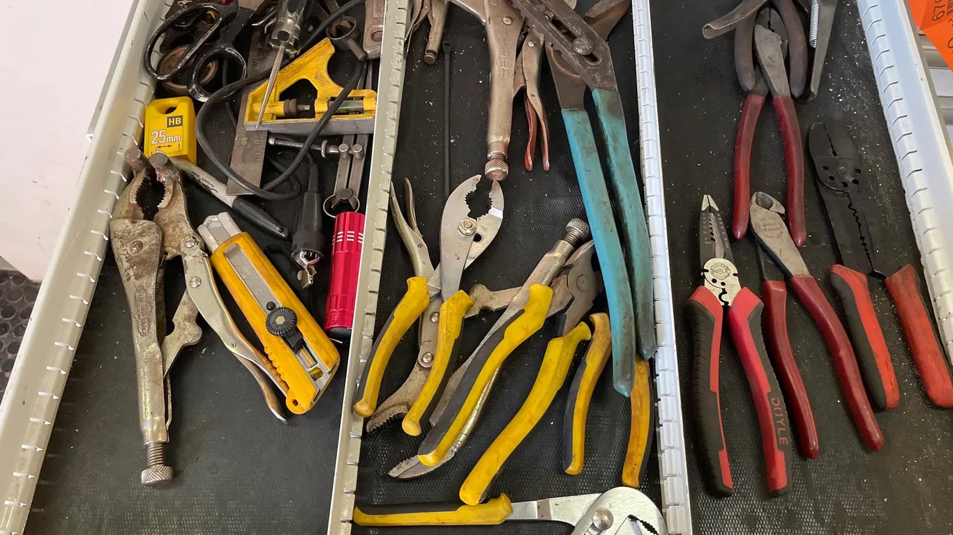 Contents of Tool Chest Drawer Including Locking Pliers, Wire Strippers, Utility Knife, and More