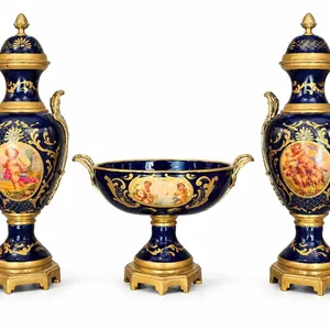 Spanish Sèvres. Three Cobalt Blue Porcelain Vases with Gilded Accents and Painted Scenes