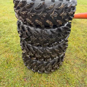 set of 4 quad tires with rims  (GST 5% charged)