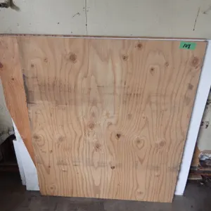 lot of partial sheets of plywood etc