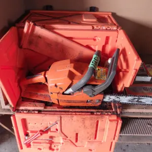 Husqvarna 55 chain saw in case with extra chains and bar