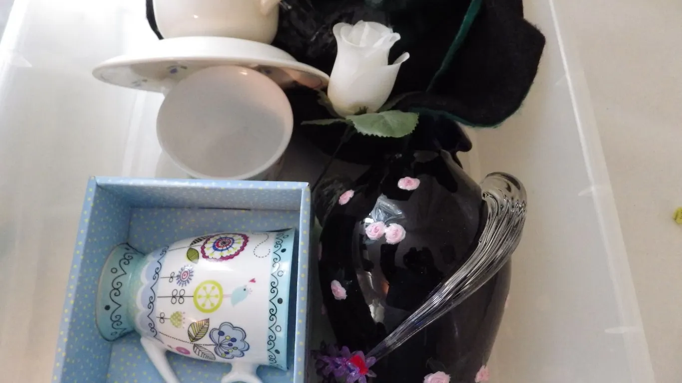 plastic Container with teacup decorations etc