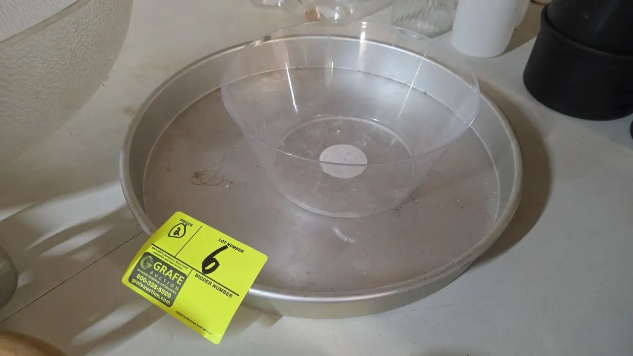 Wilton 2105-6141 round bake pan with Way to Celebrate KQ-308077 plastic treat bowl. Includes 17" x 2" round aluminum baking pan and 10" diameter clear
