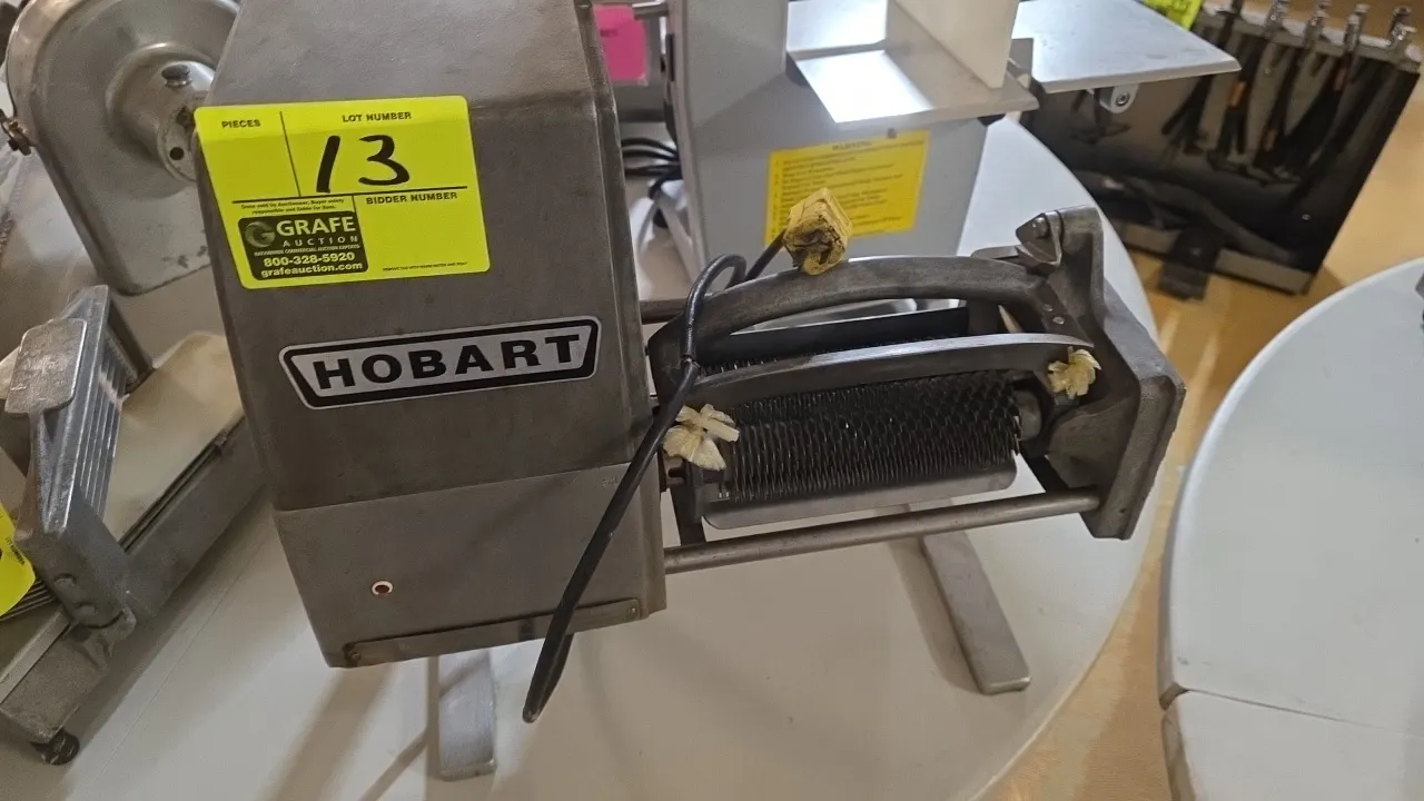 Hobart meat cuber. Features tenderizer blade roll assembly, cast aluminum housing, and attached power cord. Countertop design.