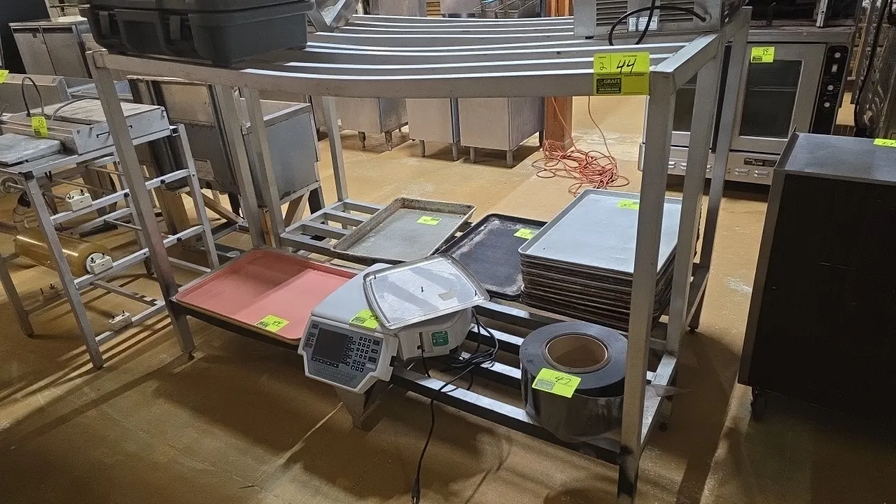 Aluminum 2-tier dunnage racks. Features welded aluminum tubular construction and 2-tier design. 72" x 20" x 48". Note: Top shelf shows bowing. Content