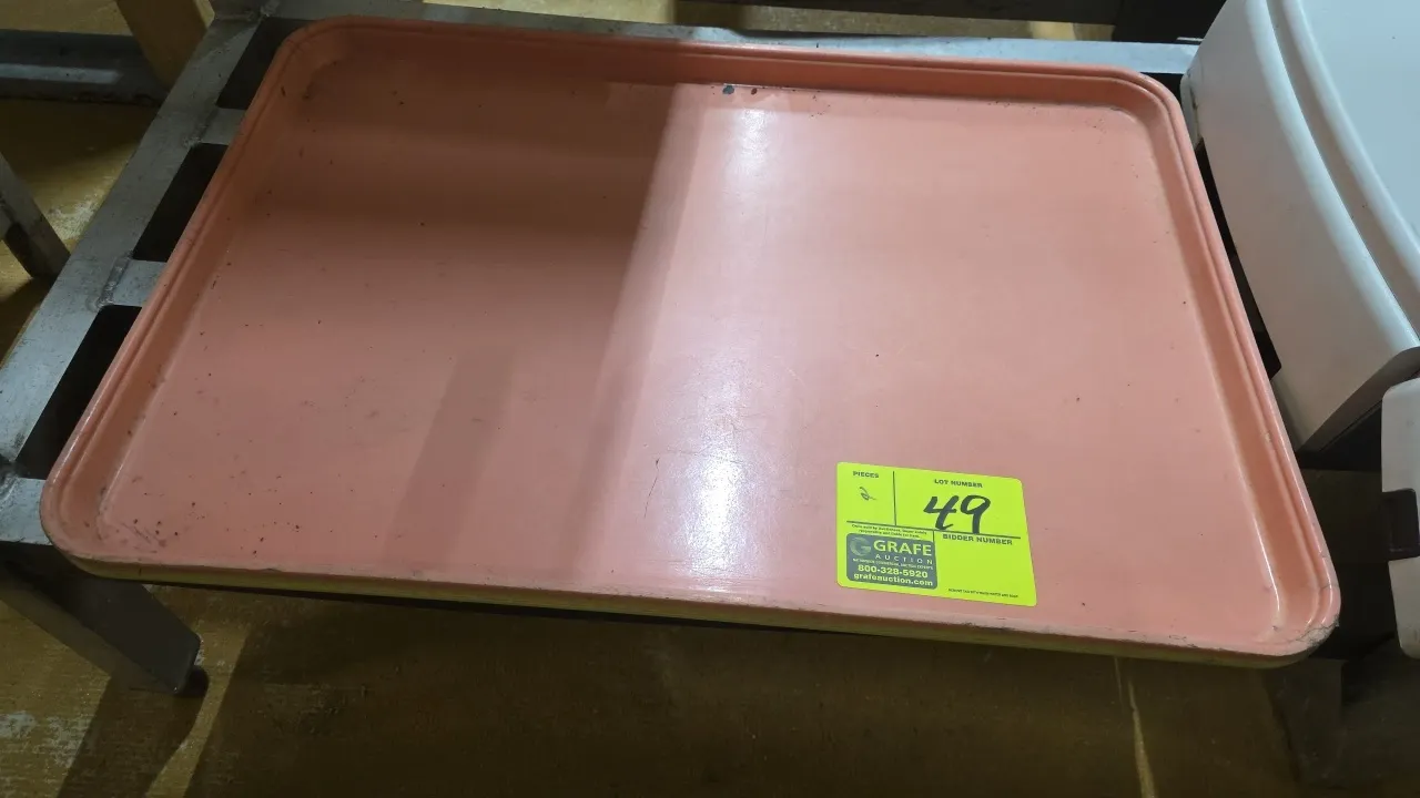 Cambro Market-Tray full-size bakery display trays. Features molded fiberglass construction with reinforced edges. Includes pink and yellow trays.