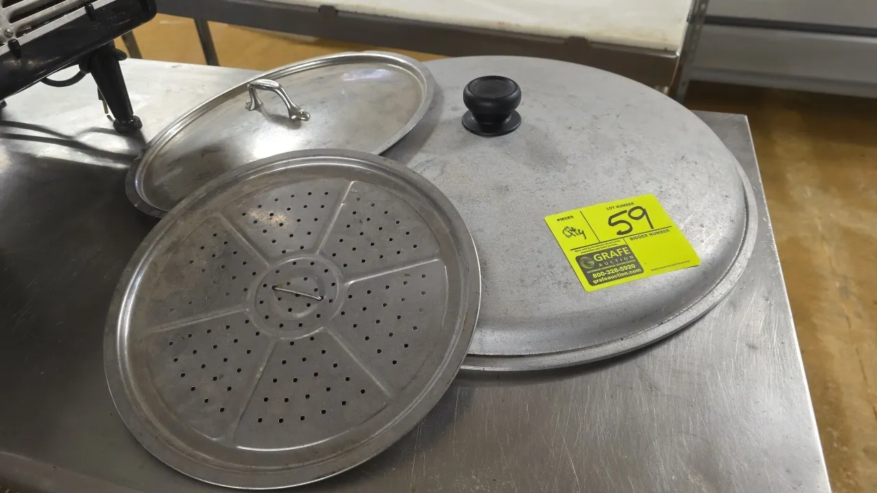 Assorted commercial cookware lids and insert. Includes (1) large domed pot lid with knob, (1) round pot lid with loop handle, and (1) perforated steam