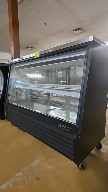 True TSID-72-2-RC self-contained slant-glass deli display case. Features a stainless steel top, slant front glass, rear sliding glass doors, adjustabl