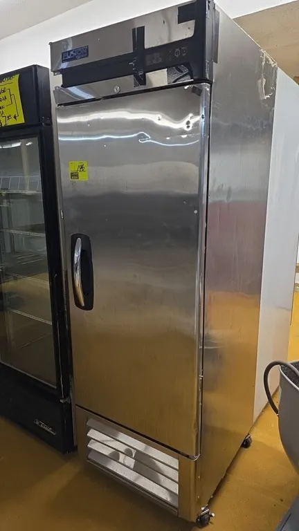 Master-Bilt Fusion R23-S commercial reach-in refrigerator. Features stainless steel construction, single solid door, interior wire shelving, and digit