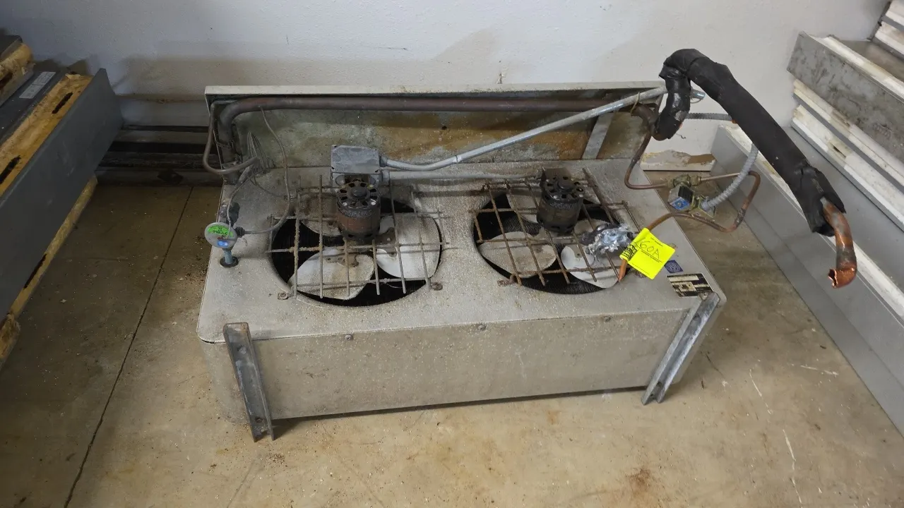 McQuay RUA-110A 2-fan evaporator coil. Features 2 fan motors with protective wire guards and textured aluminum casing. S/N: Y101659. Electrical: 115V,