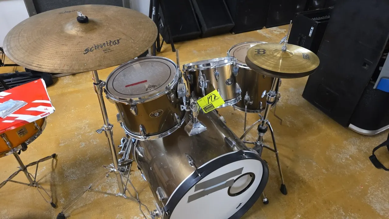 Tama Imperialstar drum set. Features bronze-finish shells including a bass drum, (2) rack toms, and a floor tom. Includes Meinl HCS hi-hat cymbals wit