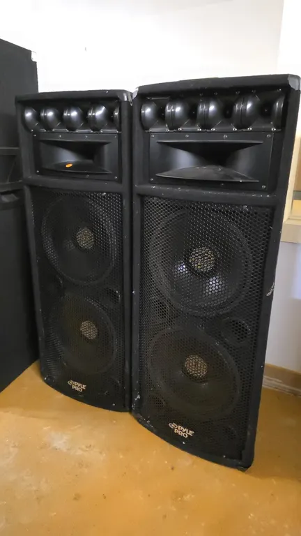 Pyle-Pro PADH212 PA loudspeakers. Each features dual 12" subwoofers with 2" Kapton voice coils, a 5"x12" horn midrange/tweeter, four piezo tweeters, c