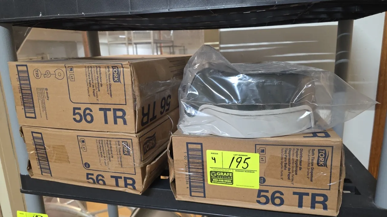 Tork 56TR twin jumbo roll bath tissue dispensers. Features translucent smoke plastic construction designed to accommodate two 9" jumbo rolls and T22 s