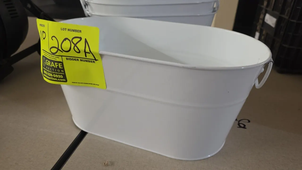 Metal oval tubs. Features painted metal construction and dual side wire handles. Includes (9) white tubs and (1) green tub. Dimensions: 12" x 7" x 5.7