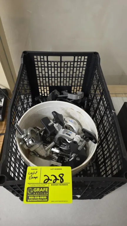 Assorted stage lighting clamps. Includes Global Truss CJS5004F aluminum coupler clamps (SWL 200 kg, 48-51mm), aluminum hook clamps, and black C-clamps