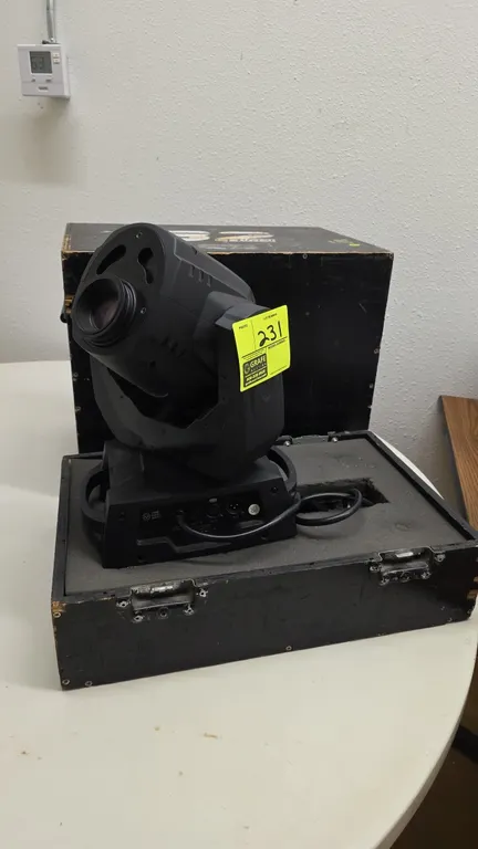 ADJ Vizi LED Spot moving head stage lighting fixture. Features 3-pin DMX in and out connections, integrated carry handles, and attached power cable. I