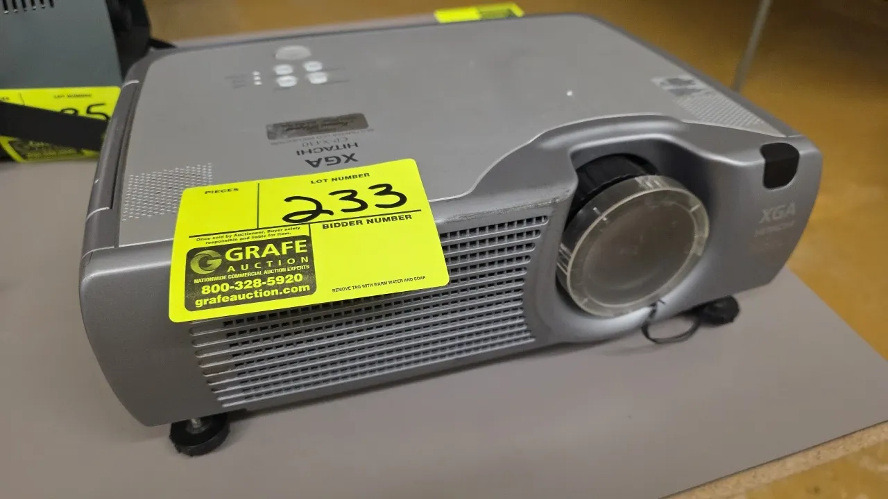 Hitachi CP-X430 multimedia LCD projector. Features native XGA resolution, manual focus and zoom lens assembly, tethered clear lens cap, top-panel cont