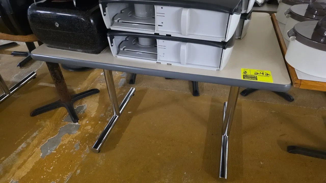 Laminated dining tables. Features laminate tops with protective edge banding. 42" x 30". Mounted on chrome bases. Contents not included.