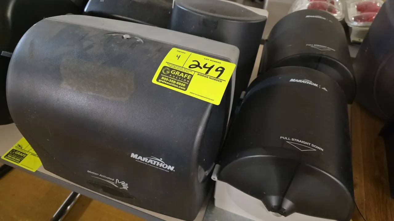 Marathon paper towel dispensers. Includes (3) manual centerpull pull-down dispensers and (1) motion-activated touchless dispenser. Constructed of blac