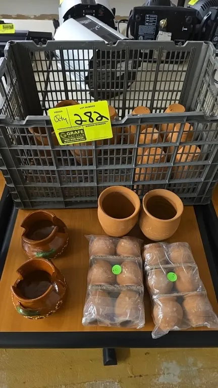 Assorted clay pots. Includes glazed earthenware vessels with decorative painted accents, assorted unglazed terracotta cups, and (2) 6-packs of miniatu