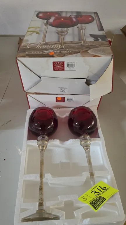 Home Essentials & Beyond Charisma Style 2126 hurricane candle holders. Lot includes (6) total candle holders in (2) 3-piece sets. Features red glass g