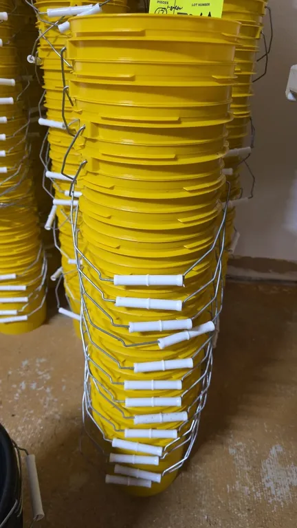 Letica 1-gallon poly pails. Includes (17) yellow HDPE pails featuring wire bail handles with white plastic grips and 60 mil wall thickness.