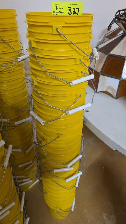 Letica 1-gallon poly pails. Includes a stack of (26) yellow HDPE buckets featuring wire bail handles with plastic hand grips and 50 mil wall thickness