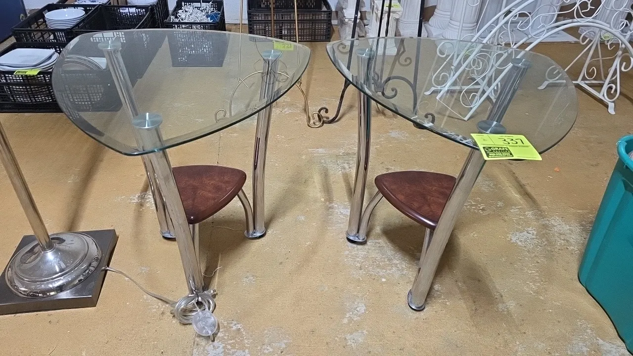 Glass top accent tables. Features rounded triangular glass tops, lower wood-finish shelves, and chrome-finished tubular metal legs. 25½"H. Floor lamp