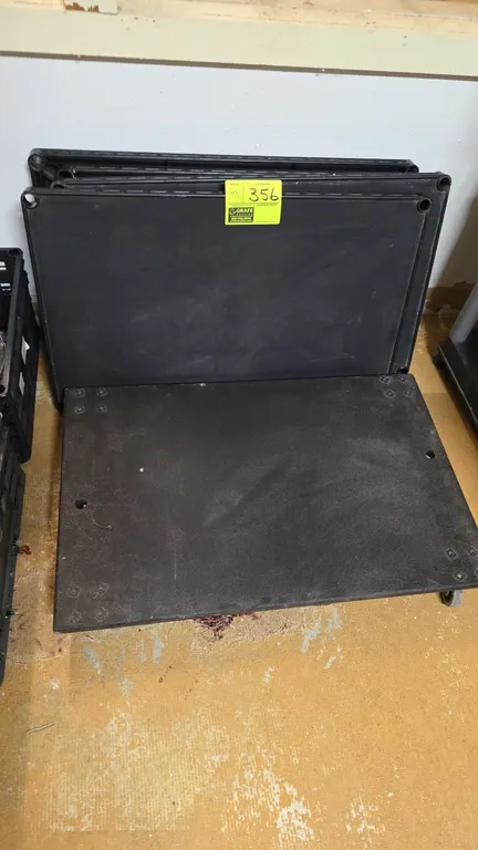 Poly 4-wheel platform dolly and poly shelving panels. Features molded plastic construction. Dolly is mounted on 4 swivel casters.