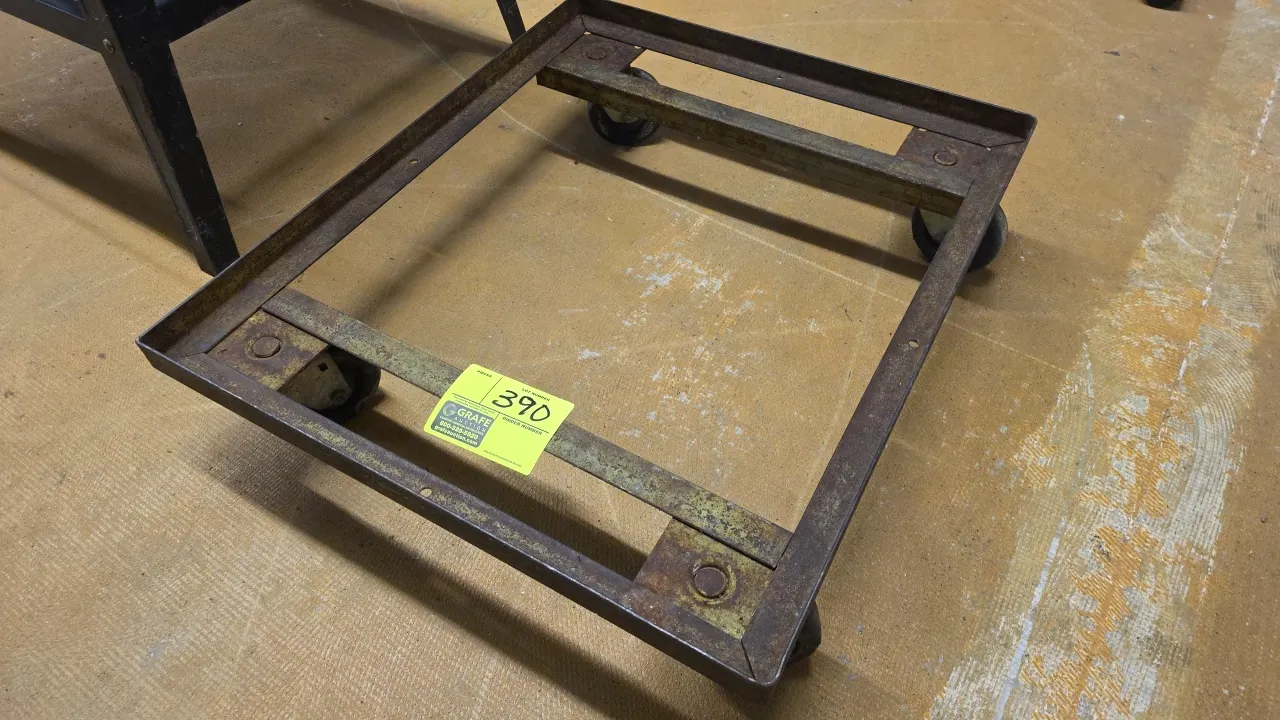 Metal 4-wheel dolly. Features angle iron frame construction. Dimensions: 22.75" x 27.25". Mounted on 4 swivel casters.