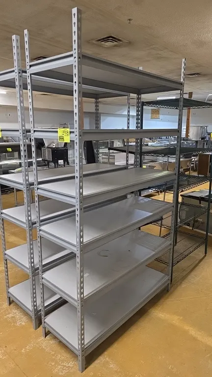 6-tier steel shelving unit. Features six solid decking shelves with gray slotted angle upright posts and beams. 48"L x 18"W x 86"H.