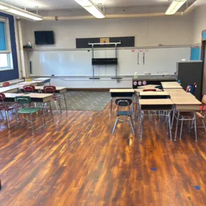 Room(30) (18) Chairs (25) Desks and a Area Rug