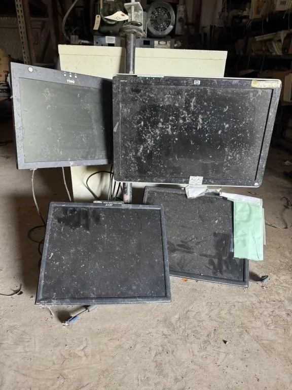 Four monitors and holder.
