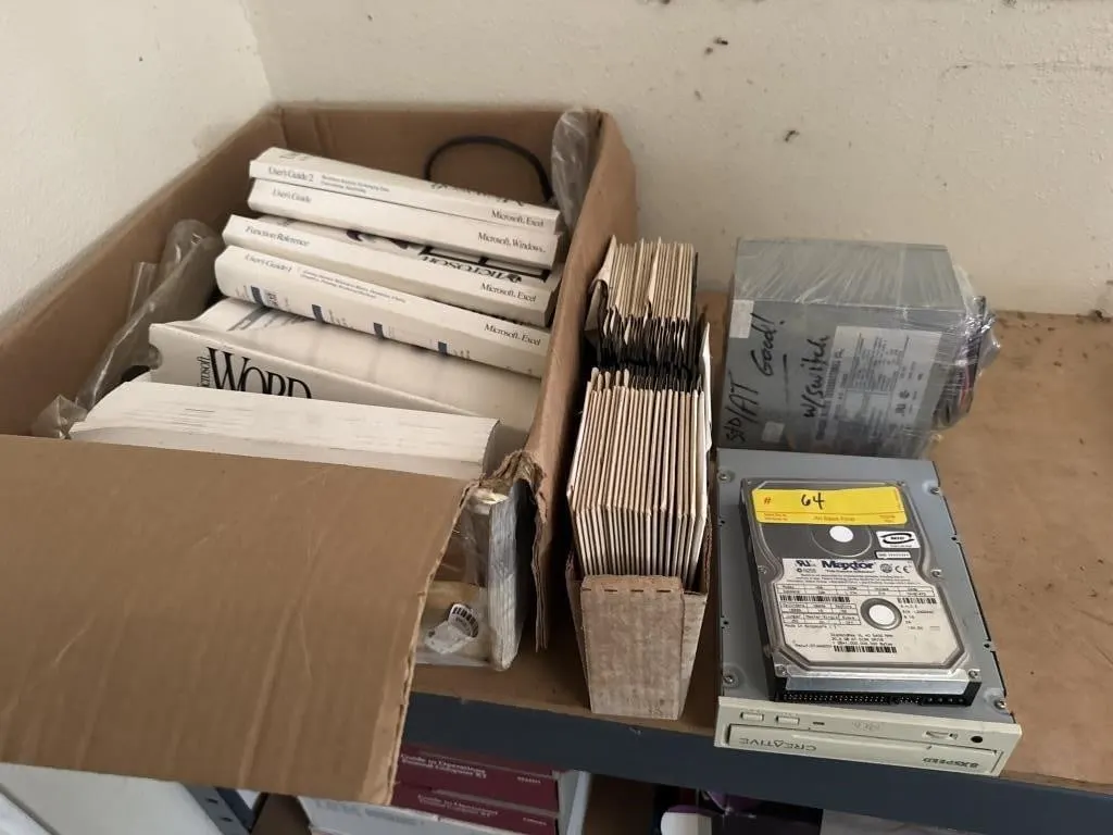 Floppy disks, box Microsoft books, Personal Daq/56